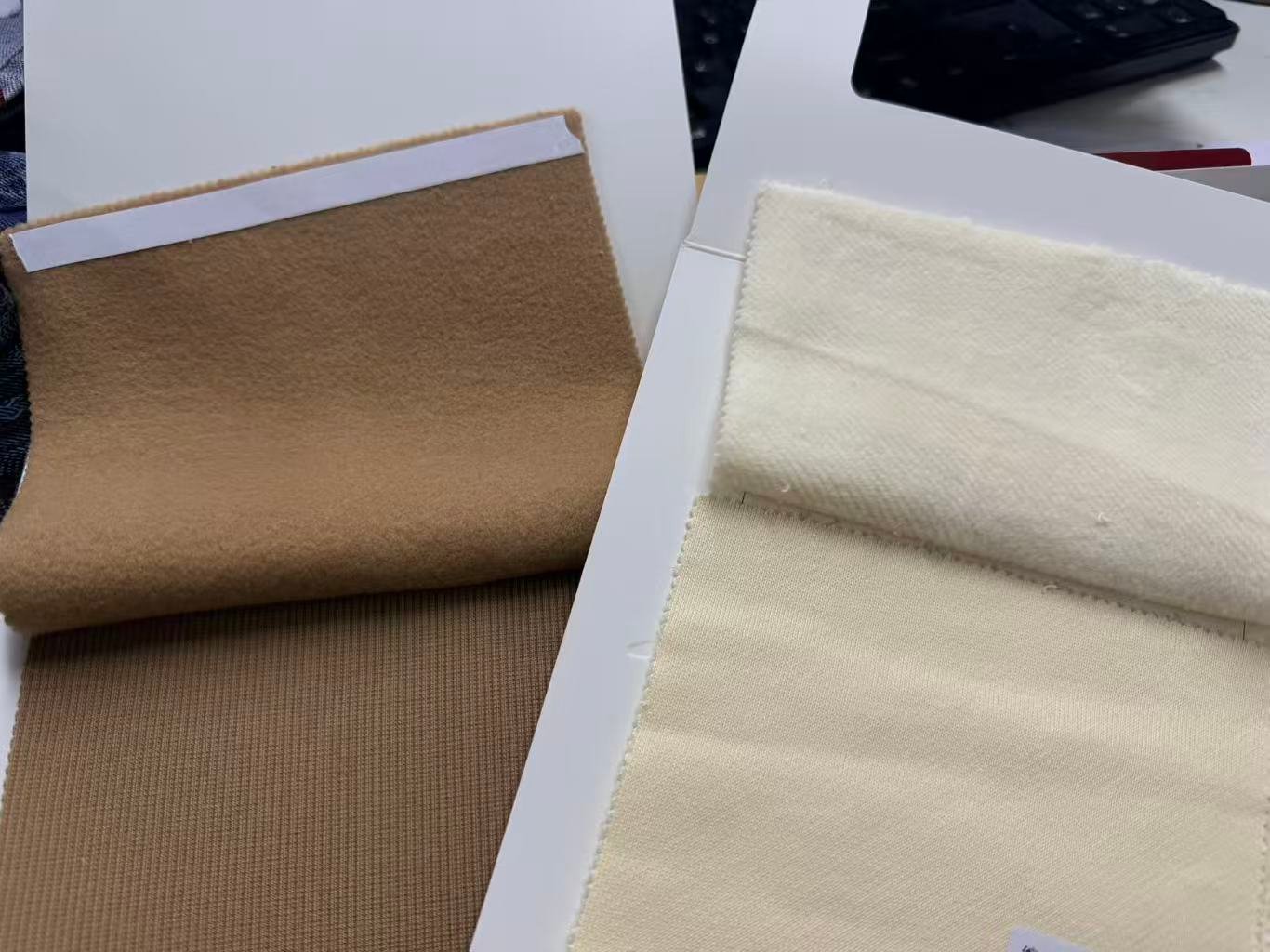Fabric swatches for private label t-shirt sample development at DeCheng Garment factory