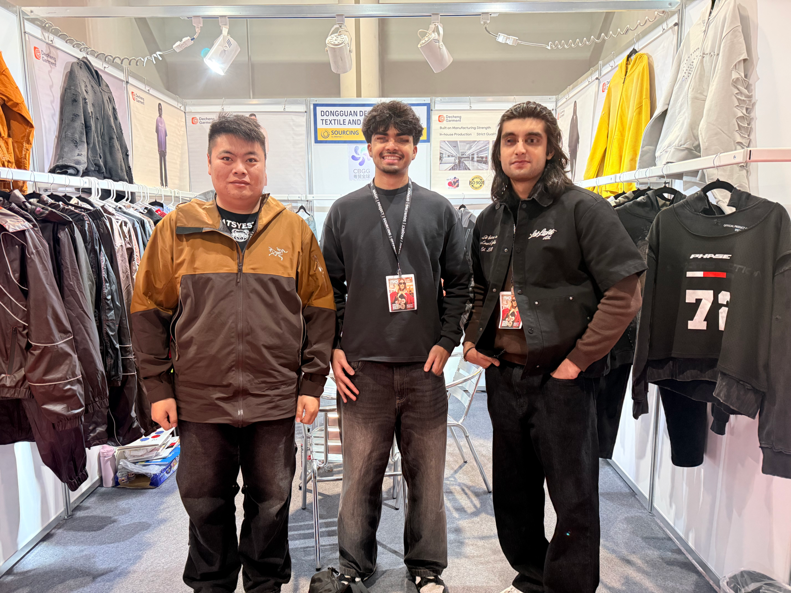 Multiple private label apparel brand owners at DeCheng Garment trade show booth