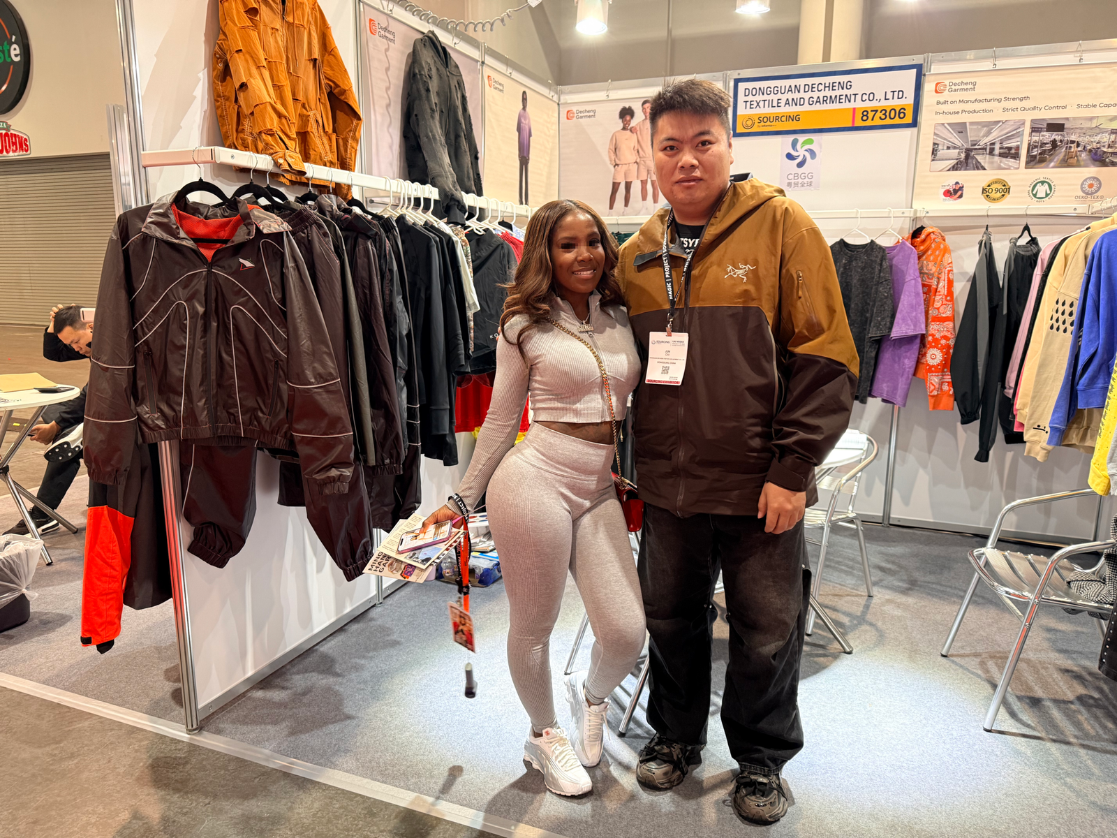 Private label clothing brand client visiting DeCheng Garment booth at MAGIC Las Vegas